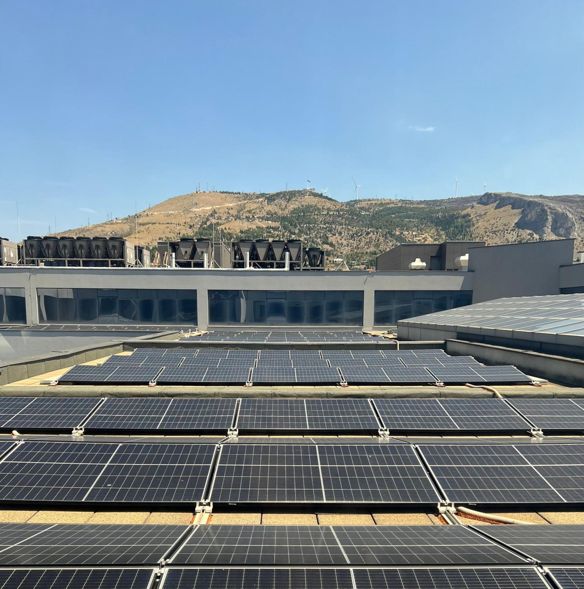 Hotel Mepas Mostar Exterior foto Solar panels on the roof of the building